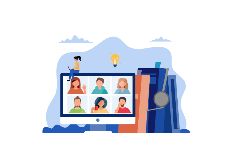 Monitor z postaciami na biurku obok książek